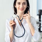 Headshot of a smiling woman, Andreea Ionescu, a long-time practitioner.